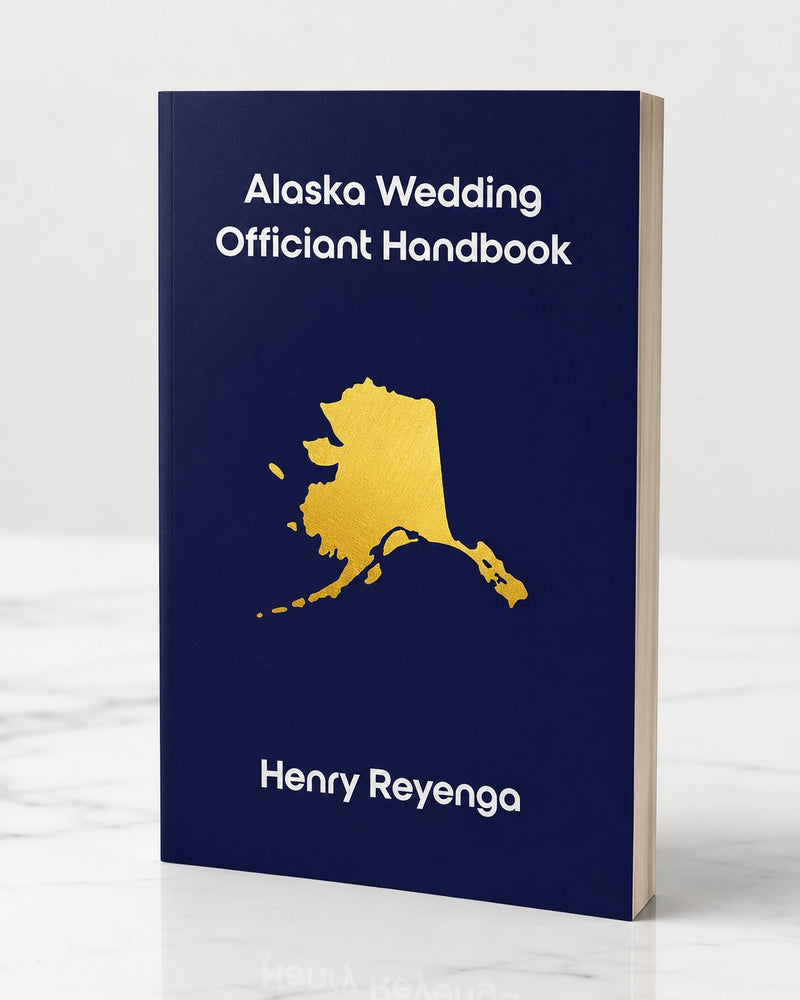 Book titled 'Alaska Wedding Officiant Handbook' by Henry Reyenga with a gold map of Alaska on a blue background.