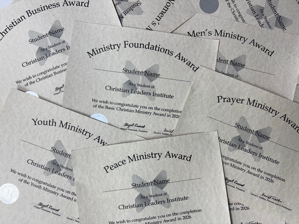 A pile of printed award certificates from Christian Leaders Institute, including titles such as Ministry Foundations Award, Prayer Ministry Award, Youth Ministry Award, and Peace Ministry Award, arranged overlapping on a neutral surface.