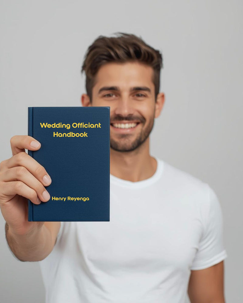 Man holding a 'Wedding Officiant Handbook' by Henry Reyenga against a plain background
