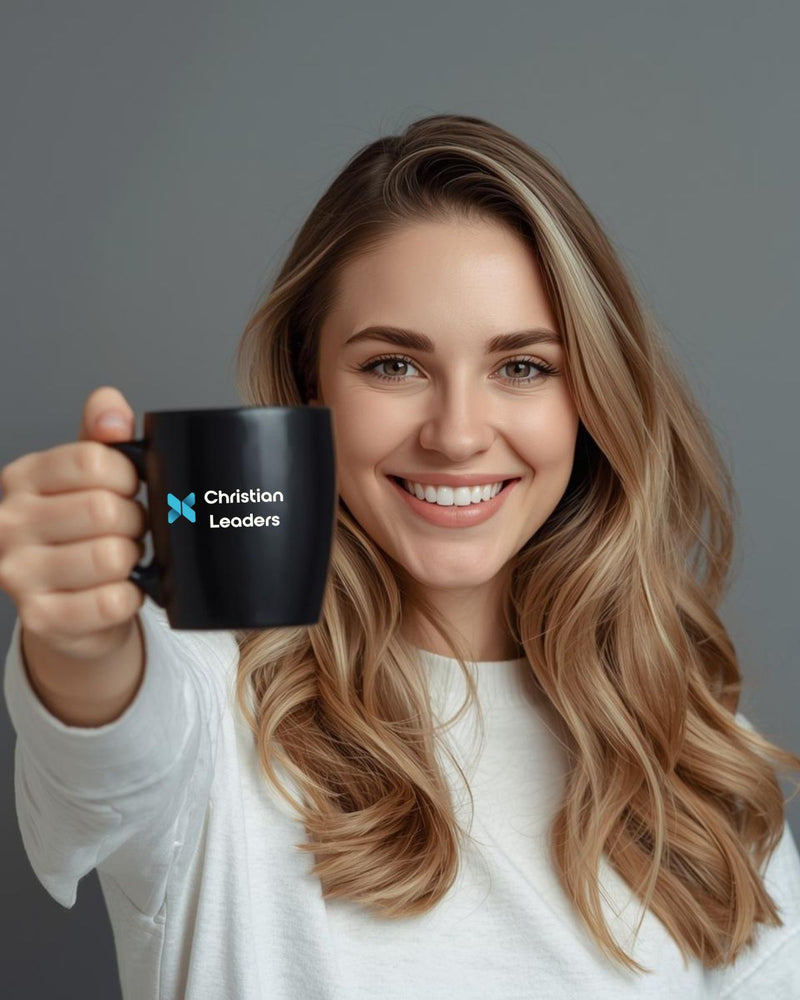 Woman holding a black mug with 'Christian Leaders' logo against a gray background